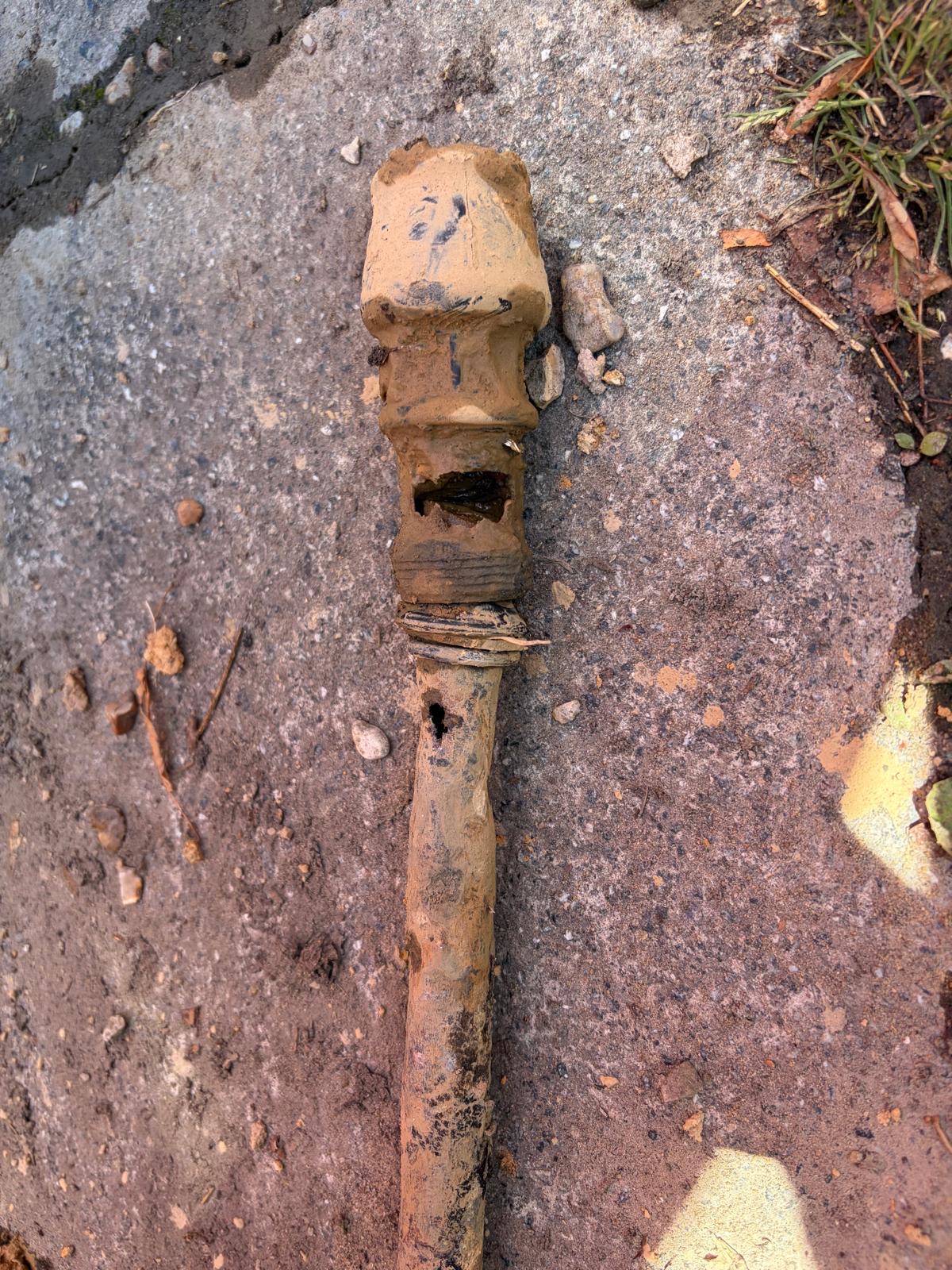 Old galvanised steel water supply pipe with multiple pinhole leaks and heavy corrosion after removal from a Sussex driveway.