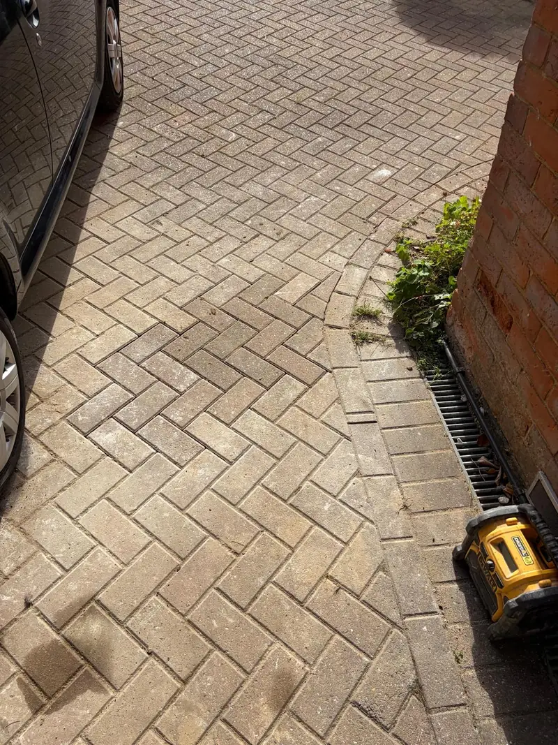 Block paving reinstated beside the building after the Oxted pipe installation.